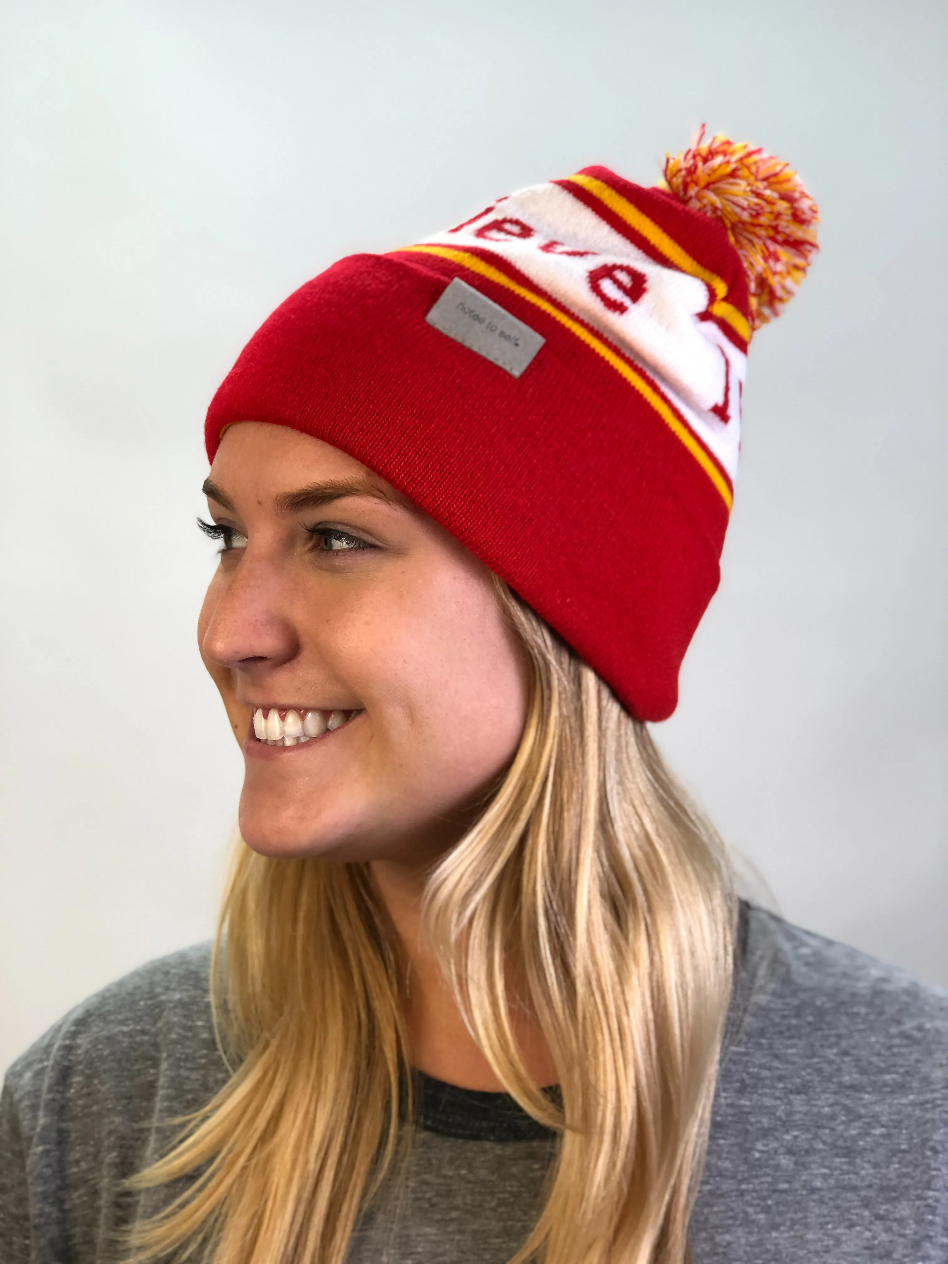 I believe™ red & gold knit beanie with We are awesome™ on inside cuff